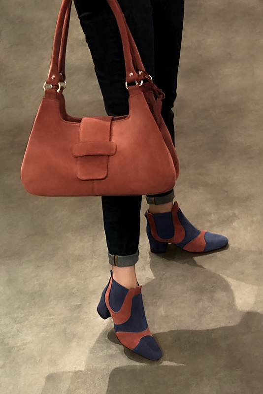 Navy blue and terracotta orange women's ankle boots, with elastics. Round toe. Low flare heels. Worn view - Florence KOOIJMAN